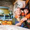 elderly woman and young child with witches hat
