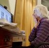 Old woman in front of computer